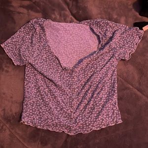 blue shirt with white flowers